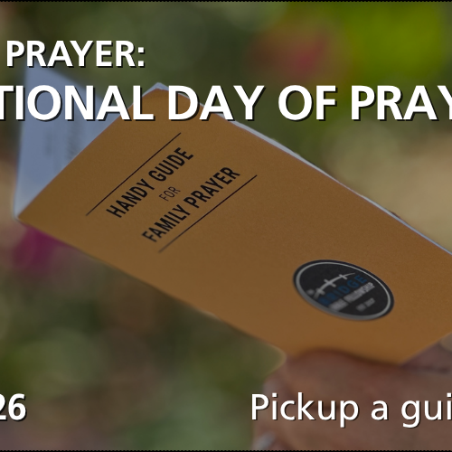 Image of a woman holding a Handy Guide for Family Prayer booklet.